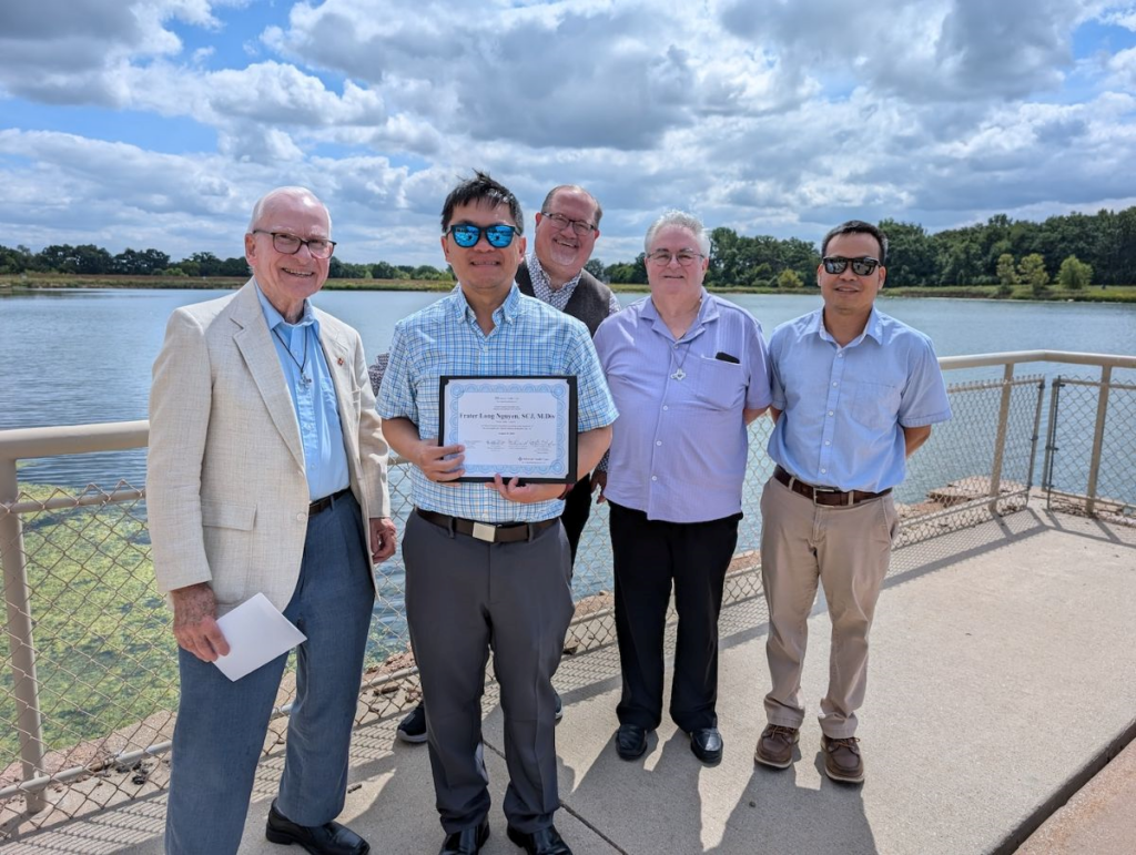 Frater Long Nguyen, SCJ, receiving CPE program (Clinical Pastoral Education) Certificate from Aurora Healthcare with Fr. John Czyzynski, SCJ, Br. Duane Lemke, SCJ, Br. Brian Tompkins, SCJ, and Fr. Duy Nguyen, SCJ