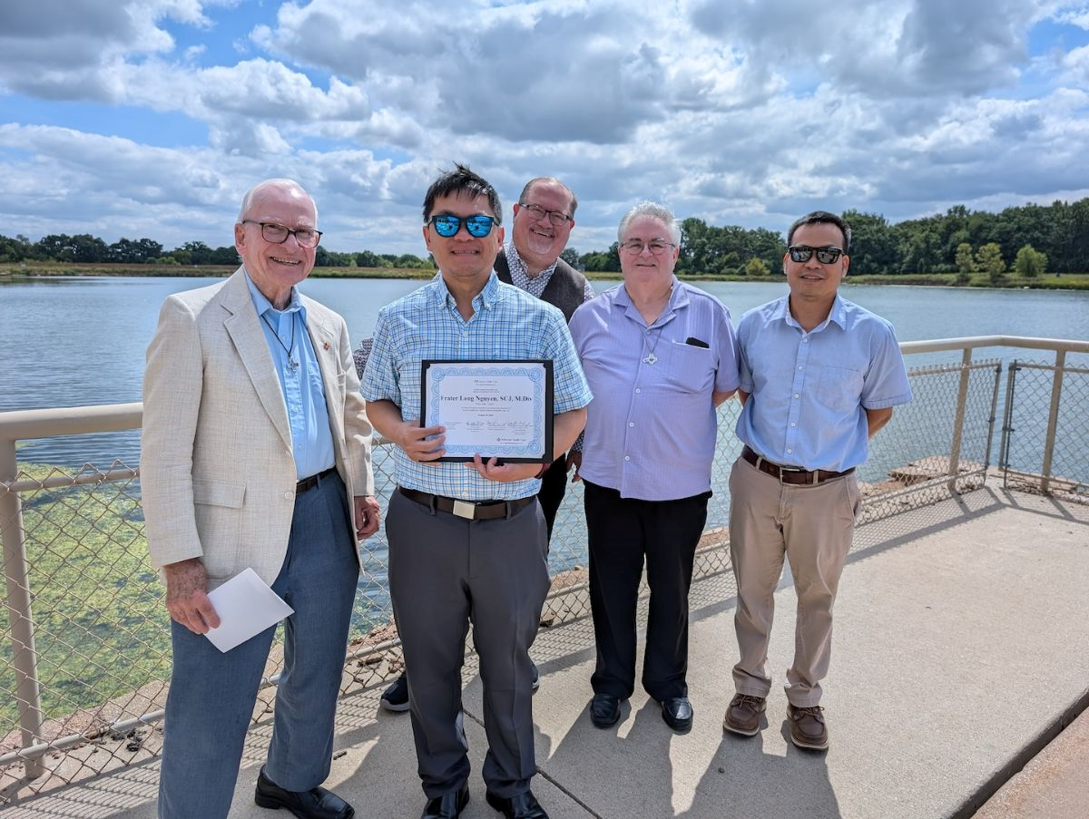 Frater Long Nguyen, SCJ, receiving CPE program (Clinical Pastoral Education) Certificate from Aurora Healthcare with Fr. John Czyzynski, SCJ, Br. Duane Lemke, SCJ, Br. Brian Tompkins, SCJ, and Fr. Duy Nguyen, SCJ