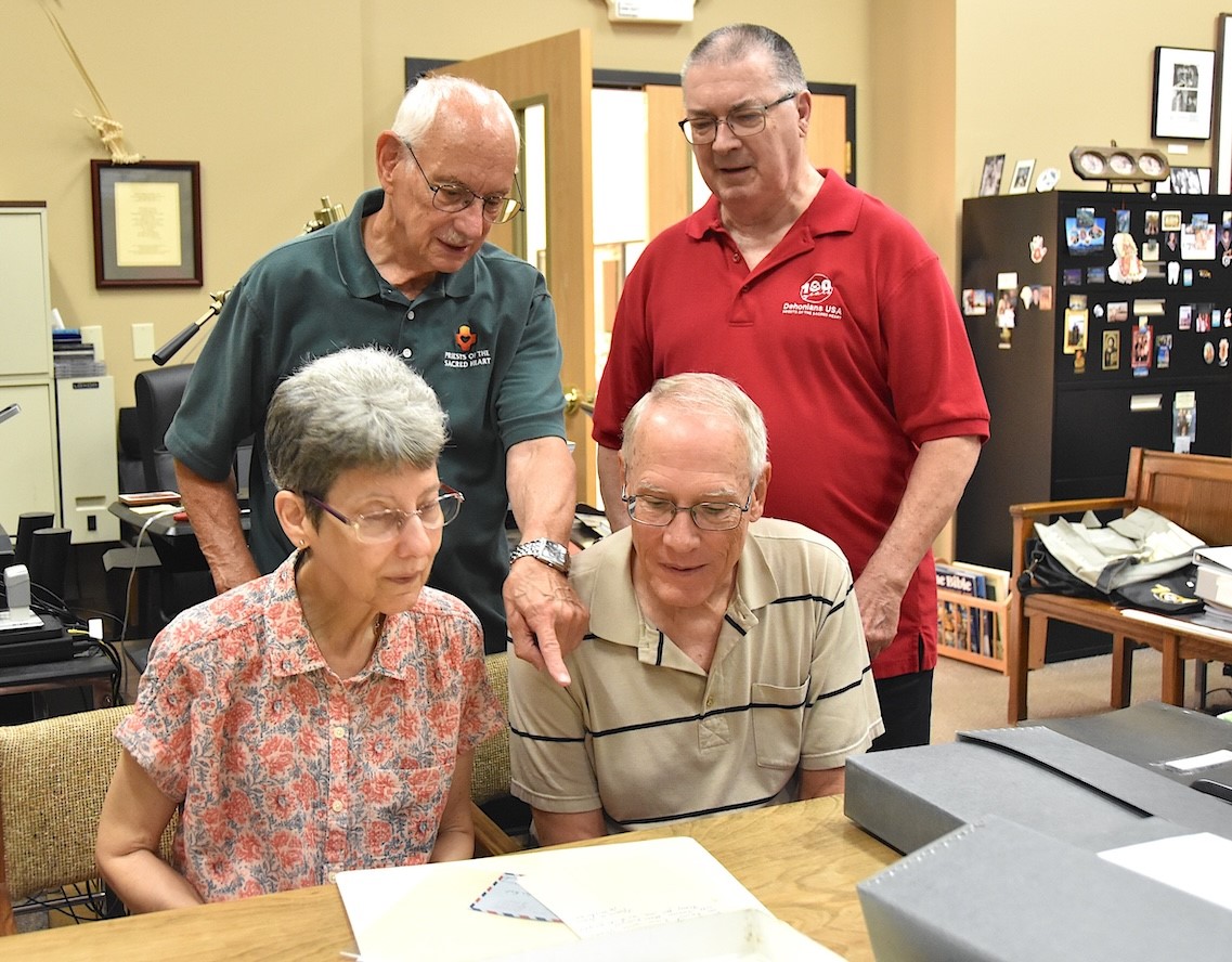 Fr. Wayne Jenkins, SCJ, provincial archivist, is pictured here (red shirt) with Fr. Dominic, John and Catherine, reviewing the letters.