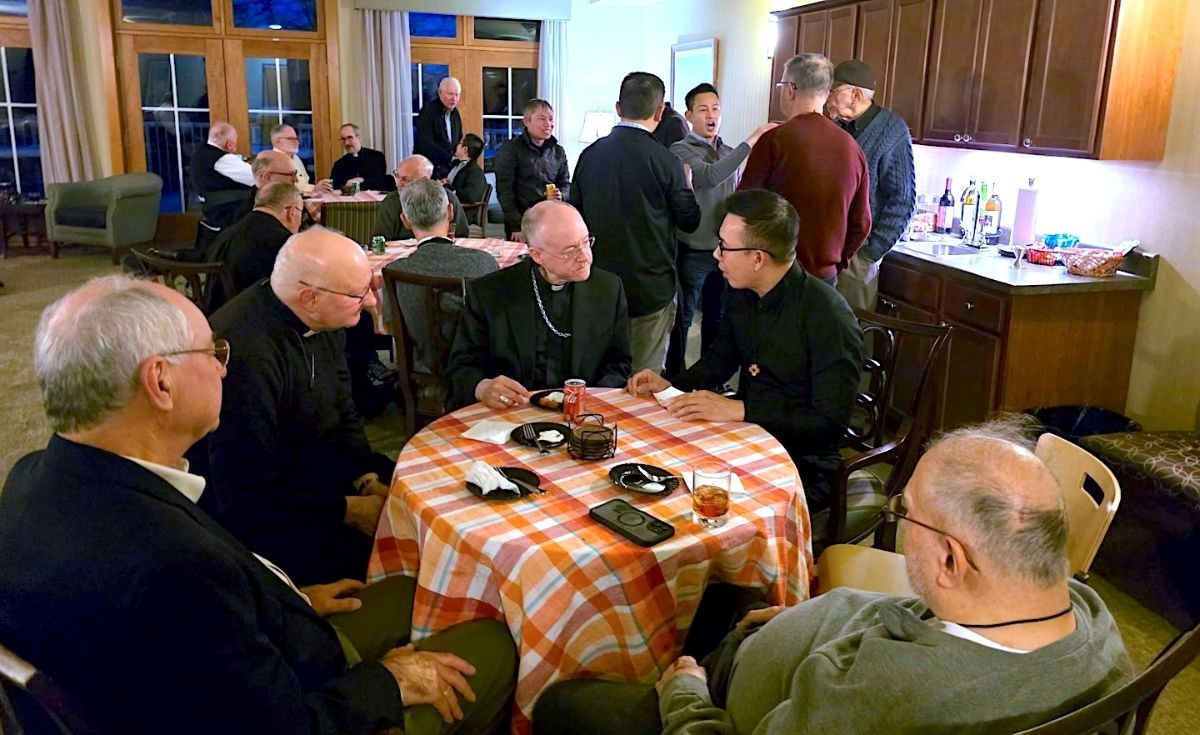 Milwaukee Archbishop Jeffrey Grob Fr. Jim Walters, SCJ, and Fr. Vien during a social at the SCJ residence.